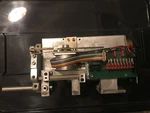 Weco Lens Edger Axis Complete Assy New 1090 7364. Fixed Price $850.00.