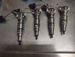 Ford 6.0 Fuel Injector Set Of 4 Reman Used Good Not Core. Fixed Price $400.00.