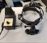 Propper Heine Omega Binocular Indirect Ophthalmoscope With Power Supply. Fixed Price $795.00.